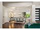 Formal dining room with hardwood floors and modern light fixture at 9113 Golden Eagle Dr, Las Vegas, NV 89134