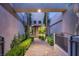 Elegant entryway with a paved pathway and lush landscaping at 9113 Golden Eagle Dr, Las Vegas, NV 89134