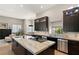 Gourmet kitchen features a large island with marble countertops and stainless steel appliances at 9113 Golden Eagle Dr, Las Vegas, NV 89134