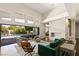 Open living area with a fireplace and access to the backyard at 9113 Golden Eagle Dr, Las Vegas, NV 89134