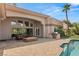 Spacious patio with built-in fire pit and grill at 9113 Golden Eagle Dr, Las Vegas, NV 89134