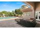 Relaxing pool area with fire pit and comfortable seating at 9113 Golden Eagle Dr, Las Vegas, NV 89134