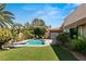 Inviting pool and lush green lawn at 9113 Golden Eagle Dr, Las Vegas, NV 89134