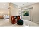Relaxing sitting area with fireplace and comfortable armchairs at 9113 Golden Eagle Dr, Las Vegas, NV 89134