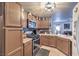 Spacious kitchen featuring brown cabinets and stainless steel appliances at 9224 Nerone Ave, Las Vegas, NV 89148