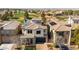 Luxury home with solar panels and a view of a golf course at 927 Via Canale Dr, Henderson, NV 89011