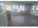 Spacious bonus room with wood floors and multiple windows for natural light and mountain views at 927 Via Canale Dr, Henderson, NV 89011