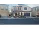 Two-story house with a front yard, attached garage, and neutral color scheme at 927 Via Canale Dr, Henderson, NV 89011