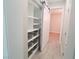 Hallway featuring built-in storage with sliding barn door and stylish metal basket storage at 927 Via Canale Dr, Henderson, NV 89011