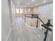 Bright upstairs hallway with wood-look floors and railing overlooking the lower level at 927 Via Canale Dr, Henderson, NV 89011