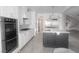 Well-equipped kitchen with a large island, stainless steel appliances, and plenty of counter space at 927 Via Canale Dr, Henderson, NV 89011