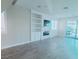 Open-concept living room with built-in shelving, fireplace, and sliding glass doors to the backyard at 927 Via Canale Dr, Henderson, NV 89011