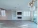 Spacious living room boasts a fireplace, built-in shelves, and abundant natural light at 927 Via Canale Dr, Henderson, NV 89011