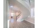 Elegant spiral staircase with natural light, offering a unique focal point in the home at 927 Via Canale Dr, Henderson, NV 89011