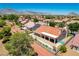 Lovely home with a covered patio and landscaped yard; mountains in the background at 9609 Eagle Valley Dr, Las Vegas, NV 89134