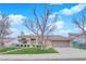 Charming single-story home featuring a red tile roof, manicured lawn, and an attached two-car garage at 9609 Eagle Valley Dr, Las Vegas, NV 89134