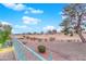 Backyard view of golf course with mature trees and desert landscaping at 9609 Eagle Valley Dr, Las Vegas, NV 89134