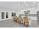 Spacious kitchen with an island, stylish chairs, and stainless steel appliances at 9609 Eagle Valley Dr, Las Vegas, NV 89134