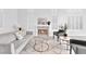 A cozy living room featuring a modern fireplace, stylish furniture, and bright, neutral decor at 9609 Eagle Valley Dr, Las Vegas, NV 89134