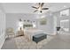 Bright and airy main bedroom with seating area, coastal accents, and natural light throughout at 9609 Eagle Valley Dr, Las Vegas, NV 89134