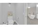 This toilet room features a standard toilet and beach themed decorations at 9609 Eagle Valley Dr, Las Vegas, NV 89134