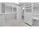 Bright walk-in closet features custom shelving and drawer units with ample storage space at 9609 Eagle Valley Dr, Las Vegas, NV 89134