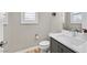 Small bathroom with toilet, sink, and vanity at 10273 Sierra Skye Ave, Las Vegas, NV 89166