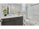 Modern bathroom with a walk-in shower and dark vanity at 10273 Sierra Skye Ave, Las Vegas, NV 89166