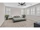 Main bedroom with platform bed, ceiling fan, and plenty of natural light at 10273 Sierra Skye Ave, Las Vegas, NV 89166