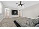 Main bedroom with king-size bed, TV, and ensuite bathroom access at 10273 Sierra Skye Ave, Las Vegas, NV 89166