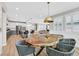 Open dining area with live-edge wood table and modern chairs at 10273 Sierra Skye Ave, Las Vegas, NV 89166