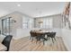 Unique dining room with live-edge wood table and modern chairs at 10273 Sierra Skye Ave, Las Vegas, NV 89166