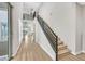 Modern staircase with sleek metal railing and light wood steps at 10273 Sierra Skye Ave, Las Vegas, NV 89166