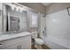 Bathroom with white cabinets, marble countertop, and bathtub at 10525 Findlay Ave, Las Vegas, NV 89134