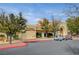 Sun Shadows Community Center exterior, featuring Spanish architecture and golf cart parking at 10525 Findlay Ave, Las Vegas, NV 89134