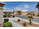 Street view of homes with desert landscaping and mountain views at 10525 Findlay Ave, Las Vegas, NV 89134