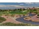 Landscaped golf course with scenic views and a winding cart path at 10525 Findlay Ave, Las Vegas, NV 89134