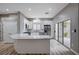 Modern kitchen with island, white cabinets and stainless steel appliances at 10525 Findlay Ave, Las Vegas, NV 89134