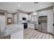 Modern kitchen with white cabinets, stainless steel appliances, and quartz countertops at 10525 Findlay Ave, Las Vegas, NV 89134