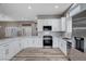 Modern kitchen with white cabinets, stainless steel appliances, and quartz countertops at 10525 Findlay Ave, Las Vegas, NV 89134