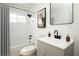 Clean bathroom with a white tub, gray vanity, and modern fixtures at 1108 Cunningham Dr, Las Vegas, NV 89106