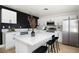 Modern kitchen with white cabinets and quartz countertops at 1108 Cunningham Dr, Las Vegas, NV 89106