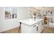 Large kitchen island with white cabinets and quartz countertops at 1108 Cunningham Dr, Las Vegas, NV 89106