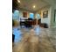 Cozy dining area with a wooden table set, tile flooring, and large windows, perfect for Gathering meals at 1136 Buckhorn Cove St, Henderson, NV 89011