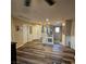 Bright second floor hallway with wood flooring, white railings, and multiple doors at 1136 Buckhorn Cove St, Henderson, NV 89011