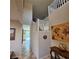 Bright hallway featuring white railing staircase, decor, and access to the outdoor pool at 1136 Buckhorn Cove St, Henderson, NV 89011