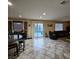 Inviting living room featuring a bar, tile flooring, access to the backyard pool, and neutral paint at 1136 Buckhorn Cove St, Henderson, NV 89011