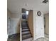 Staircase with wood treads, white risers, and a landing at 1136 Buckhorn Cove St, Henderson, NV 89011