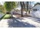 Spacious backyard with gravel area, artifical turf and tall, mature trees providing shade and privacy at 1403 5Th Pl, Las Vegas, NV 89104