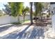 The backyard has artifical turf area, gravel area, privacy fence and some mature trees at 1403 5Th Pl, Las Vegas, NV 89104